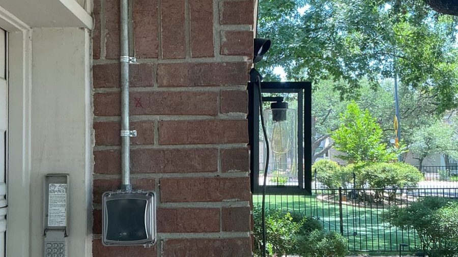 Outdoor lighting attached to exterior wall.